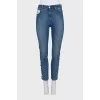 Skinny jeans with a signature logo on the side