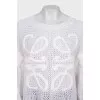 Knitted sweater with a raised logo
