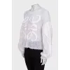 Knitted sweater with a raised logo