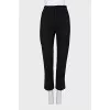 Tapered trousers with zippers at the bottom