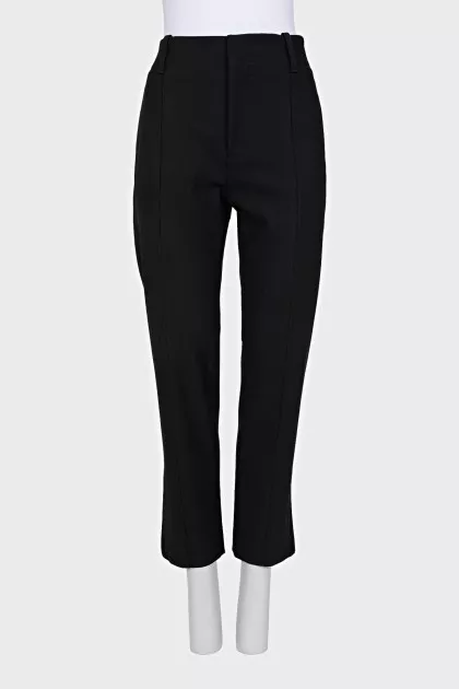 Tapered trousers with zippers at the bottom