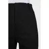 Tapered trousers with zippers at the bottom