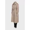 Beige double-breasted trench coat with belt