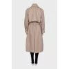 Beige double-breasted trench coat with belt