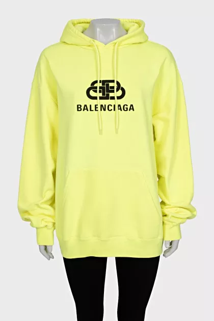 Yellow oversized hoodie with brand logo