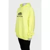 Yellow oversized hoodie with brand logo