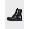 Leather boots with a zipper and perforations