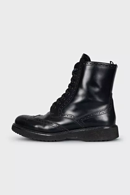 Leather boots with a zipper and perforations