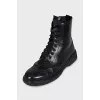 Leather boots with a zipper and perforations