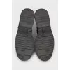 Leather boots with a zipper and perforations