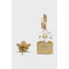 Earrings in the shape of a bottle and a flower