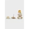 Earrings in the shape of a bottle and a flower