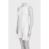 White dress with an asymmetrical side seam