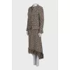 A suit consisting of a zipped jacket and a skirt