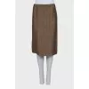 Suit consisting of a jacket with decor and a skirt