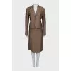 Suit consisting of a jacket with decor and a skirt