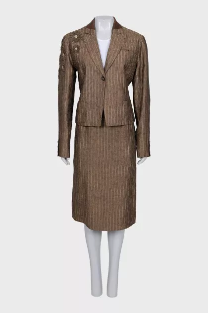 Suit consisting of a jacket with decor and a skirt