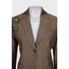 Suit consisting of a jacket with decor and a skirt