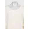 Knitted sweater with a ripped effect