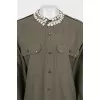 Asymmetrical shirt decorated with crystals