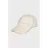 White cap with embroidered logo