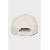 White cap with embroidered logo