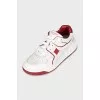 White sneakers with spikes