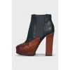 Leather ankle boots with a relief pattern