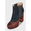 Leather ankle boots with a relief pattern