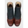 Leather ankle boots with a relief pattern