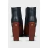 Leather ankle boots with a relief pattern