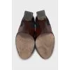 Leather ankle boots with a relief pattern