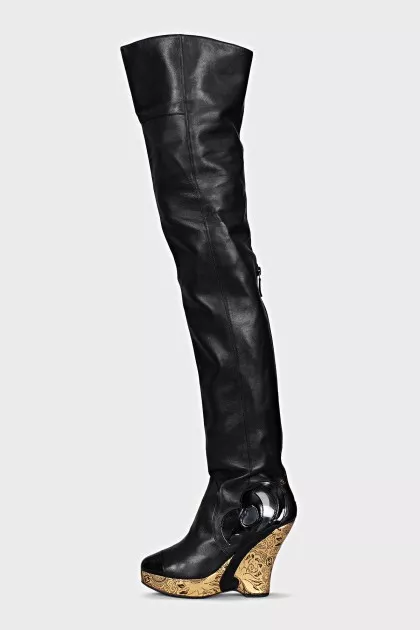 Leather over-the-knee boots with a gold wedge heel