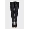 Leather over-the-knee boots with a gold wedge heel