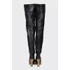 Leather over-the-knee boots with a gold wedge heel
