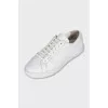 Leather sneakers with a gold logo
