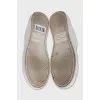 Leather sneakers with a gold logo