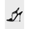 Black sandals with metallic decor