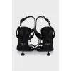 Black sandals with metallic decor
