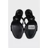 Black sandals with metallic decor