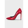 Red leather pumps