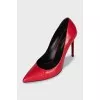 Red leather pumps