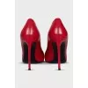 Red leather pumps
