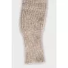 Knitted gloves with a finger hole
