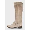 Gray boots decorated with a strap