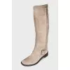 Gray boots decorated with a strap