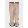 Gray boots decorated with a strap