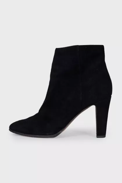 Black suede ankle boots with a zipper