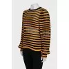 Striped jumper with back fastening