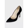 Black pony skin pumps